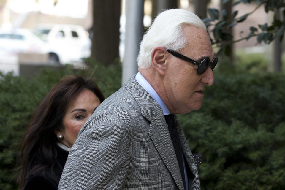 Roger Stone accompanied by his wife Nydia Stone, left, arrives at federal court in Washington, Thursday, Nov. 14, 2019. (AP Photo/Jose Luis Magana)