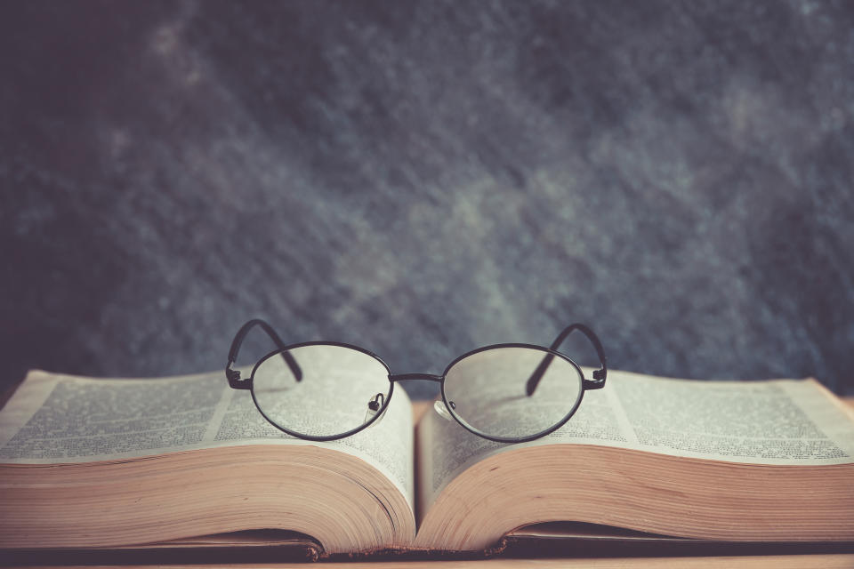 Pair of eyeglasses sitting on a book