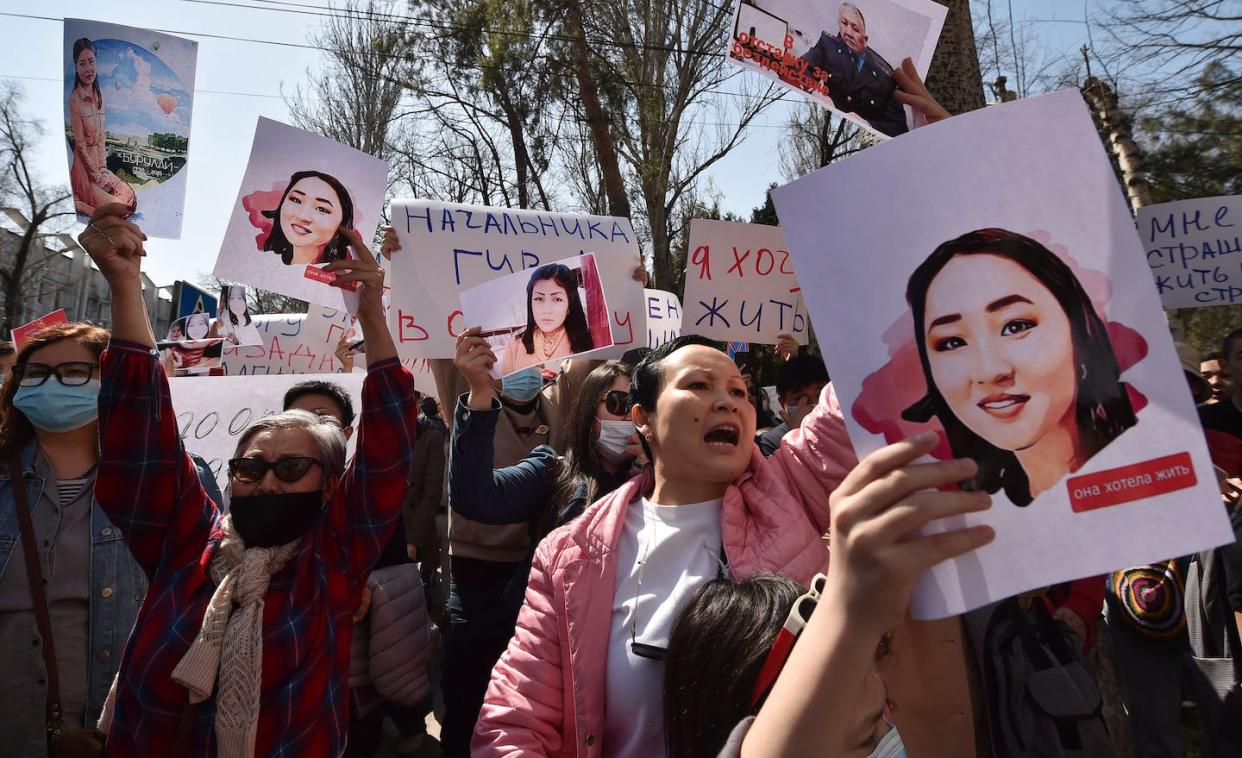 A protest against bride kidnapping in Kyrgyzstan's capital, Bishkek, on April 8, 2021, after a young woman abducted for marriage was found dead. <a href="https://www.gettyimages.com/detail/news-photo/people-hold-pictures-as-they-attend-a-rally-for-womens-news-photo/1232176999?adppopup=true" rel="nofollow noopener" target="_blank" data-ylk="slk:Vyacheslav Oseledko/AFP via Getty Images;elm:context_link;itc:0;sec:content-canvas" class="link "> Vyacheslav Oseledko/AFP via Getty Images</a>