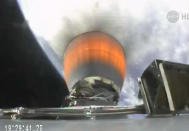 This Friday, April 18, 2014 image made from video shows the engine of the second stage of the rocket carrying the SpaceX Dragon capsule. The Dragon cargo ship is scheduled to reach the orbiting lab on Sunday, April 20, 2014 - Easter morning. (AP Photo/NASA)