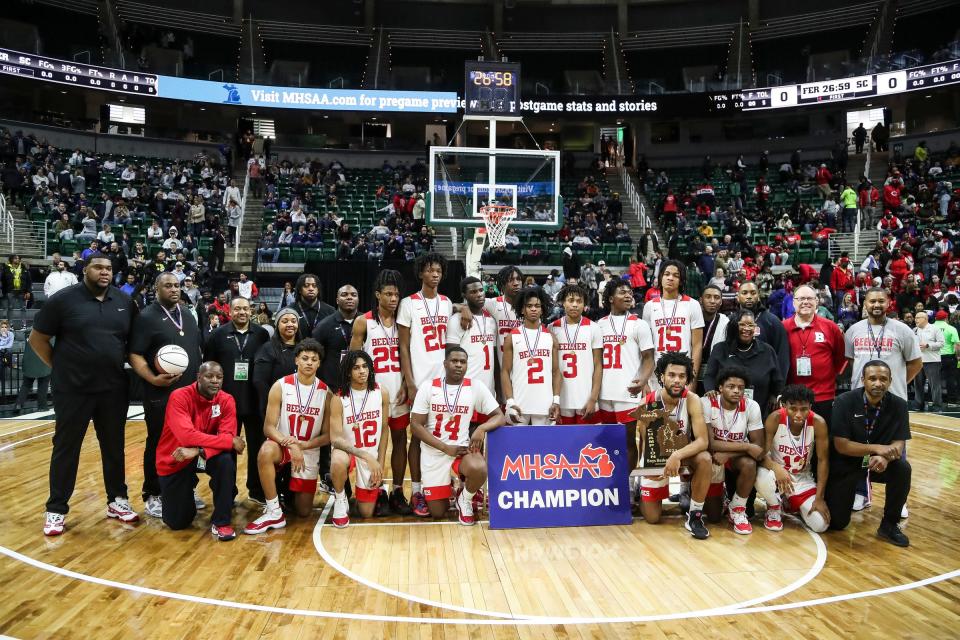 Flint Beecher players celebrate after the 64-50 win over Traverse City St. Francis in the Division 3 final at Breslin Center on Saturday, March 25, 2023.