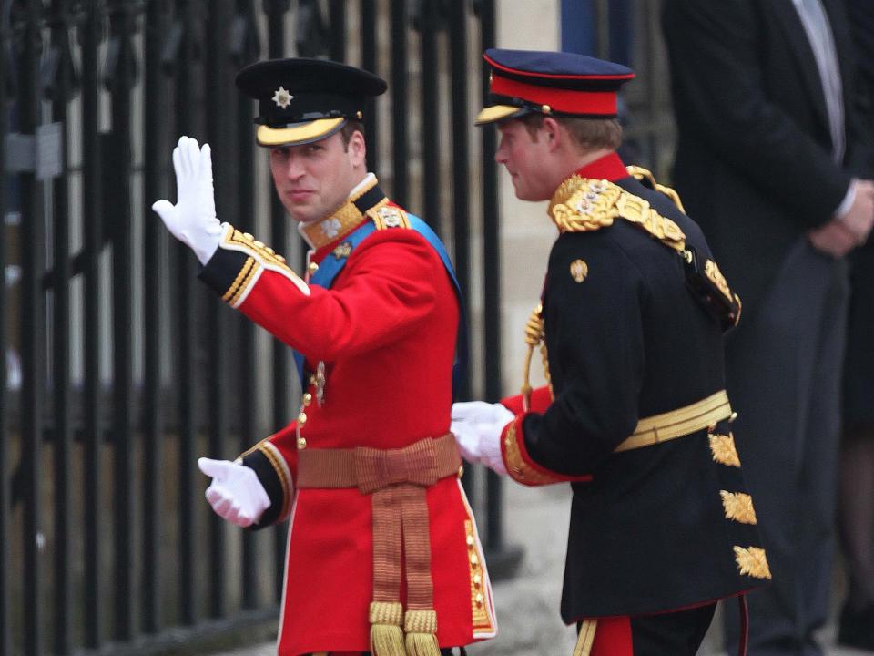 Prince William and Prince Harry in formal dress uniforms on William's wedding day in 2011.