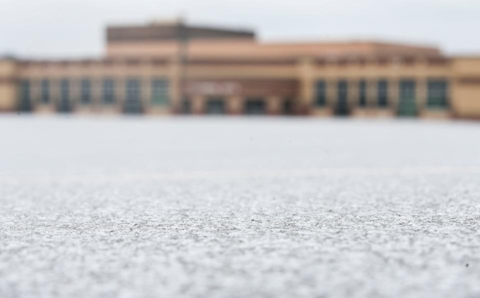 Ice covers the empty parking lot of Floyd Central High School in Floyds Knobs, Ind. on a cold Tuesday morning. Schools across metro Louisville were closed due to the inclement weather, where ice formed on the roads overnight.  Jan. 31, 2023