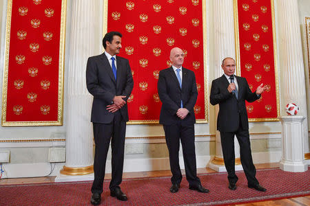 Qatar Emir Sheikh Tamim bin Hamad al-Thani, FIFA President Gianni Infantino and Russian President Vladimir Putin attend a handover ceremony for the 2022 World Cup at the Kremlin in Moscow, Russia July 15, 2018. Yuri Kadobnov/Pool via REUTERS