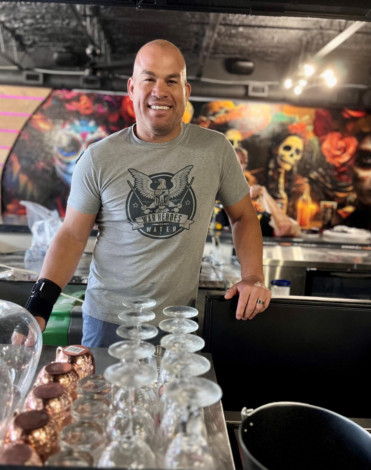 UFC Hall of Famer Tito Ortiz stands behind the bar of Tito's Cantina, his first restaurant, in Cape Coral.