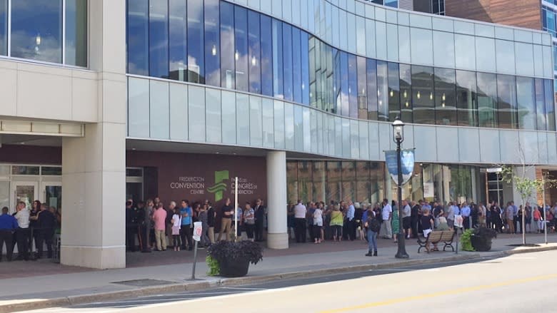 Community members line up to pay respects to fallen Fredericton officers