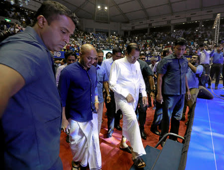 Sri Lanka's President Maithripala Sirisena is escorted by President's Security Division officers as he arrives at a special party convention in Colombo, Sri Lanka December 4, 2018. REUTERS/Dinuka Liyanawatte