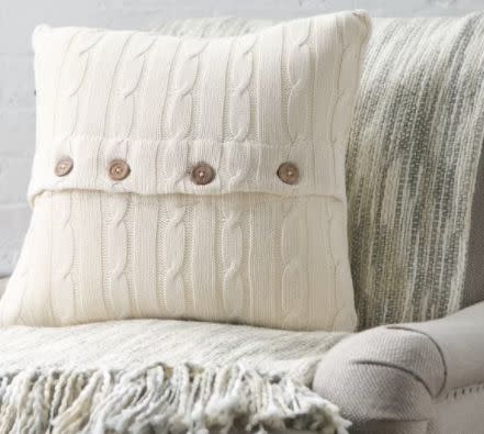 Get it <a href="https://www.wayfair.com/Three-Posts-Harrietstown-Cable-Knit-100%25-Cotton-Throw-Pillow-TRPT1893.html" target="_blank">here</a>.&nbsp;