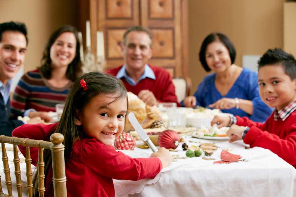 Family sitting at holiday dinner table