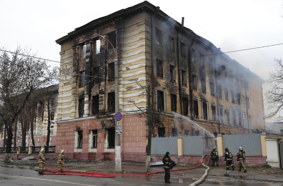 Firefighters hose down the burning building of the Central Research Institute of the Aerospace Defense Forces in the Russian city of Tver, Russia, Thursday, April 21, 2022. The press service of the local administration announced later in a statement that six people were killed and at least 27 were injured and over 10 people may be still trapped inside the building. (Vitaliy Smolnikov/Kommersant Publishing House via AP) RUSSIA OUT