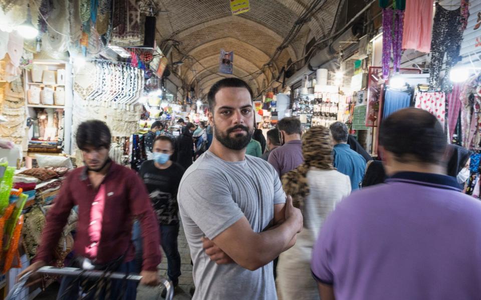 Reza Fathi at the Grand Bazaar where he works a a tout for carpet shops - Sam Tarling 