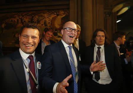 Steven Woolfe (L) and Paul Nuttall of the United Kingdom Independence Party (UKIP) react as votes are counted for the EU referendum, in Manchester, Britain June 24, 2016. REUTERS/Andrew Yates