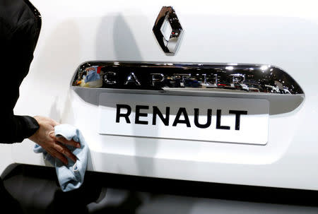 FILE PHOTO: A worker cleans a Renault Captur car at the European Motor Show in Brussels, Belgium, January 13, 2017. REUTERS/Francois Lenoir/File Photo