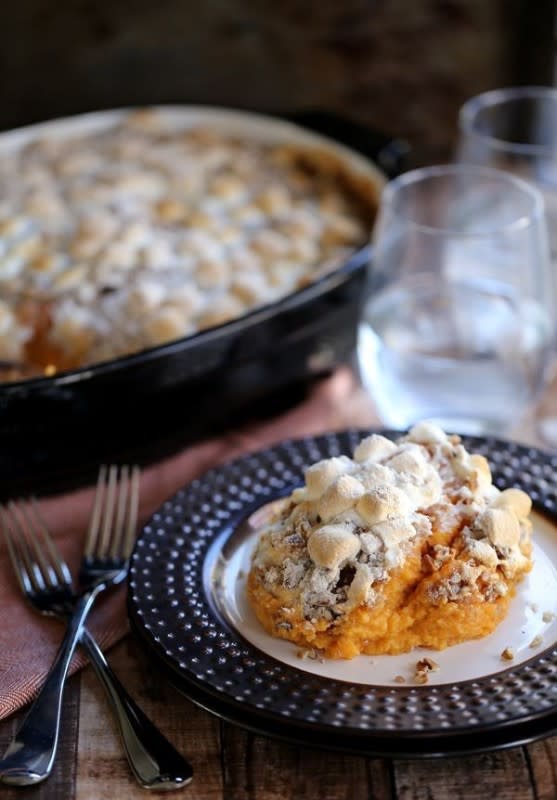 <p>Melanie Makes</p><p>This Make-Ahead Sweet Potato Casserole is a holiday side dish must! Sweet potatoes take a swim with half and half, vanilla and brown sugar before being mashed together. Then they're topped with marshmallows and pecan streusel before being baked to perfection. <a href="http://melaniemakes.com/blog/2015/11/make-ahead-sweet-potato-casserole.html" rel="nofollow noopener" target="_blank" data-ylk="slk:Get the recipe here.;elm:context_link;itc:0;sec:content-canvas" class="link rapid-noclick-resp">Get the recipe here.</a></p>