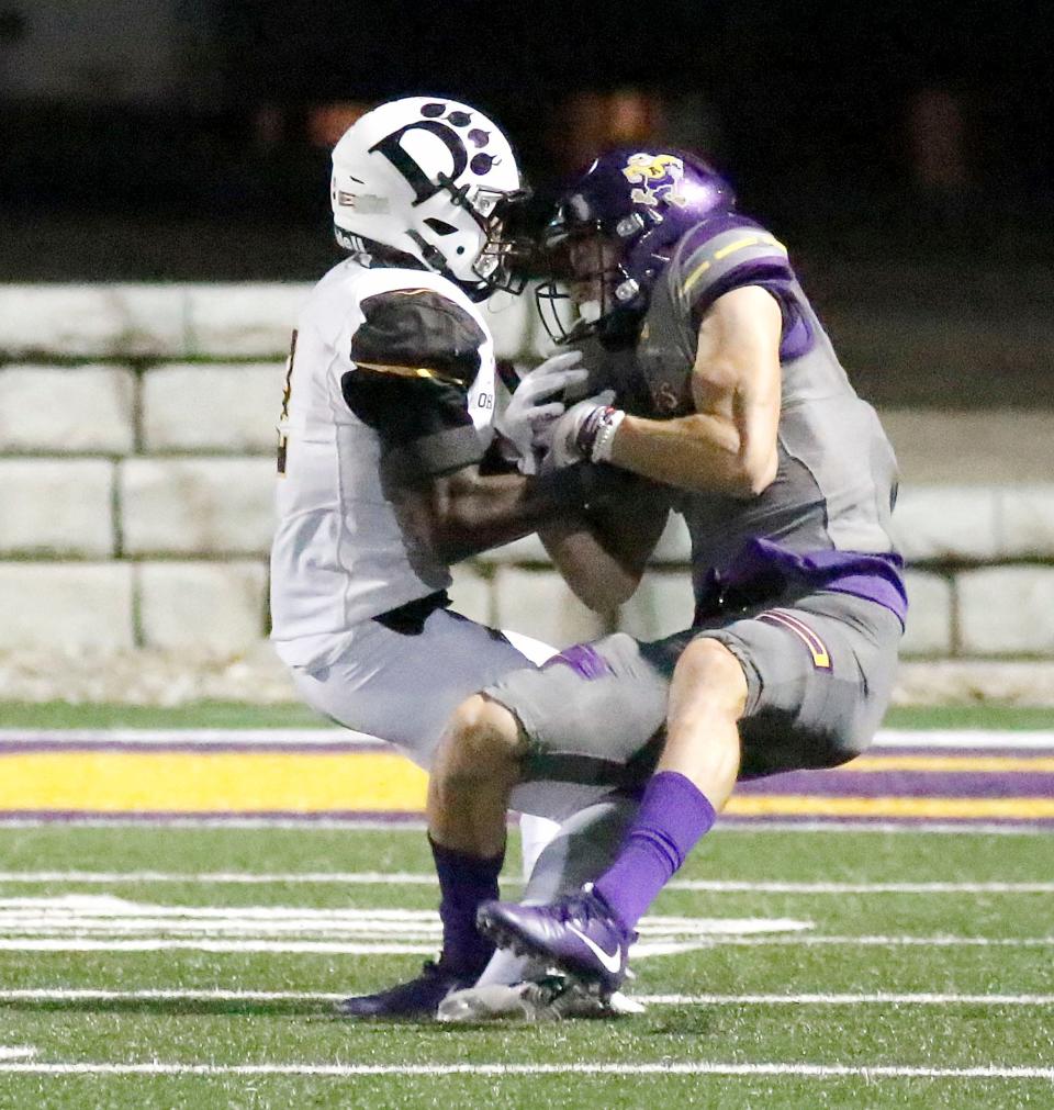 Ashland University's Jake McLoughlin (11) comes down with a pass against Ohio Dominican University's DeAndre Clark (2) during college football action Saturday, Oct. 9, 2021 at Jack Miller Stadium. TOM E. PUSKAR/TIMES-GAZETTE.COM