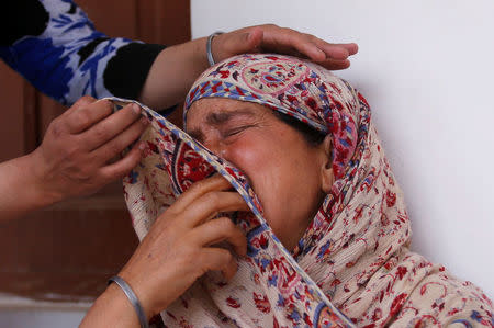 Rafiqa, mother of Shaista Hameed who was killed by a stray bullet during an encounter, cries during an interview with Reuters in Lalhar, south of Srinagar May 16, 2016. REUTERS/Danish Ismail