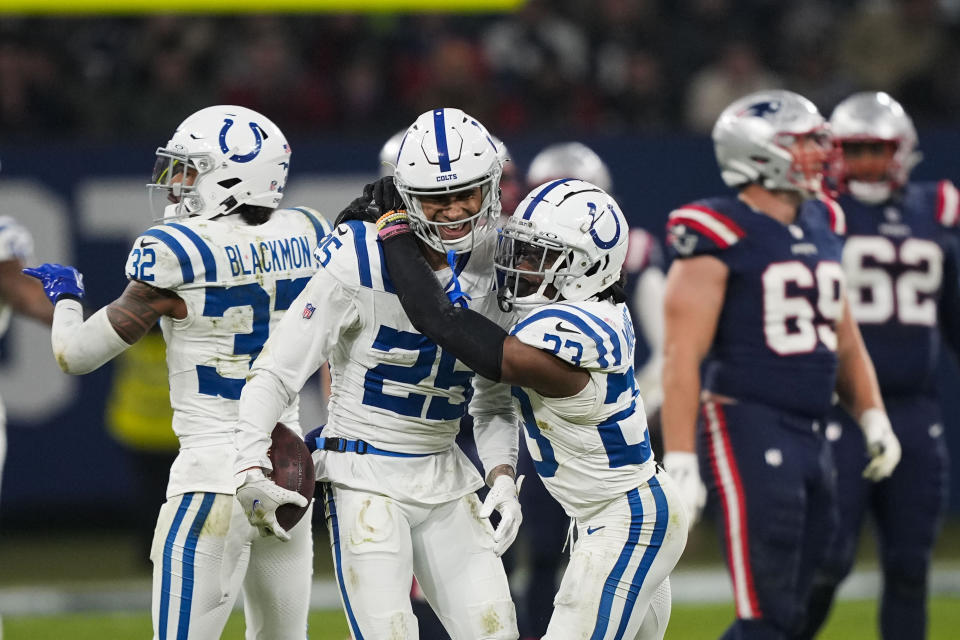 Indianapolis Colts safety Rodney Thomas II (25) celebrates his game-sealing interception with cornerback Kenny Moore II (23) in the second half of an NFL football game against the New England Patriots in Frankfurt, Germany Sunday, Nov. 12, 2023. The Colts won 10-6. (AP Photo/Martin Meissner)