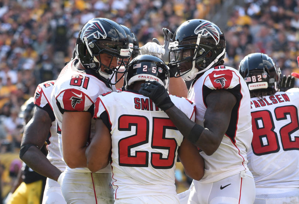 Oct 7, 2018; Pittsburgh, PA, USA;  Atlanta Falcons running back Ito Smith (25) is greeted by his teammates after scoring a fourth quarter touchdown against the Pittsburgh Steelers at Heinz Field. The Steelers won 41-17.  Mandatory Credit: Philip G. Pavely-USA TODAY Sports