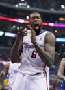 Los Angeles Clippers center DeAndre Jordan celebrates after scoring during the first half in Game 1 of an opening-round NBA basketball playoff series against the Golden State Warriors, Saturday, April 19, 2014, in Los Angeles. (AP Photo/Mark J. Terrill)