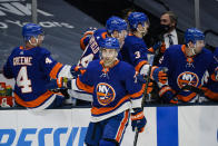 New York Islanders' Jordan Eberle (7) celebrates with teammates after scoring a goal during the third period of the team's NHL hockey game against the New Jersey Devils on Thursday, Jan. 21, 2021, in Uniondale, N.Y. (AP Photo/Frank Franklin II)