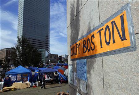 A sign marking the Occupy Boston encampment is pictured in Boston, Massachusetts October 11, 2011. REUTERS/Brian Snyder