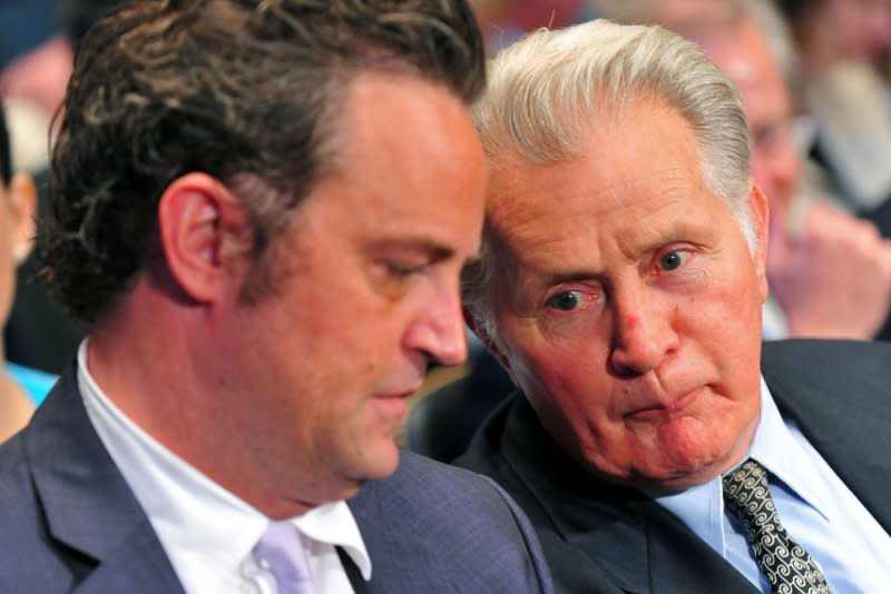 Matthew Perry (L) talks to actor Martin Sheen during a Senate Judiciary Committee Crime and Judiciary Subcommittee hearing titled "Drug and Veterans Treatment Courts: Seeking Cost-Effective Solutions for Protecting Public Safety and Reducing Recidivism," on Capitol Hill in Washington, in 2011. File Photo by Kevin Dietsch/UPI