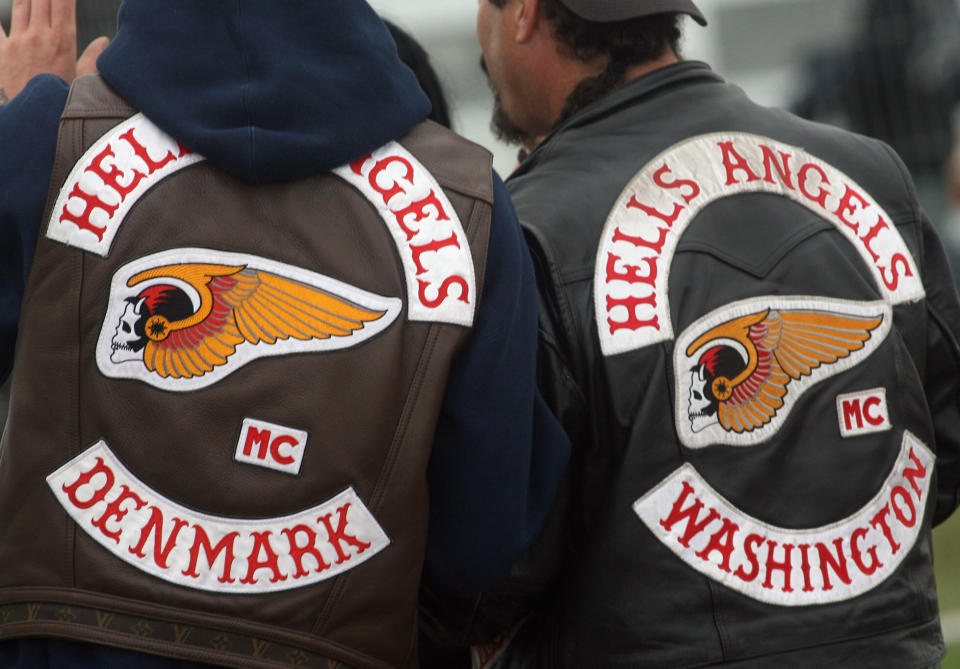 Two Hell's Angels walk around the site on the final day of the Bulldog Bash on August 10 2008 in Warwickshire, England. (Photo by Matt Cardy/Getty Images)