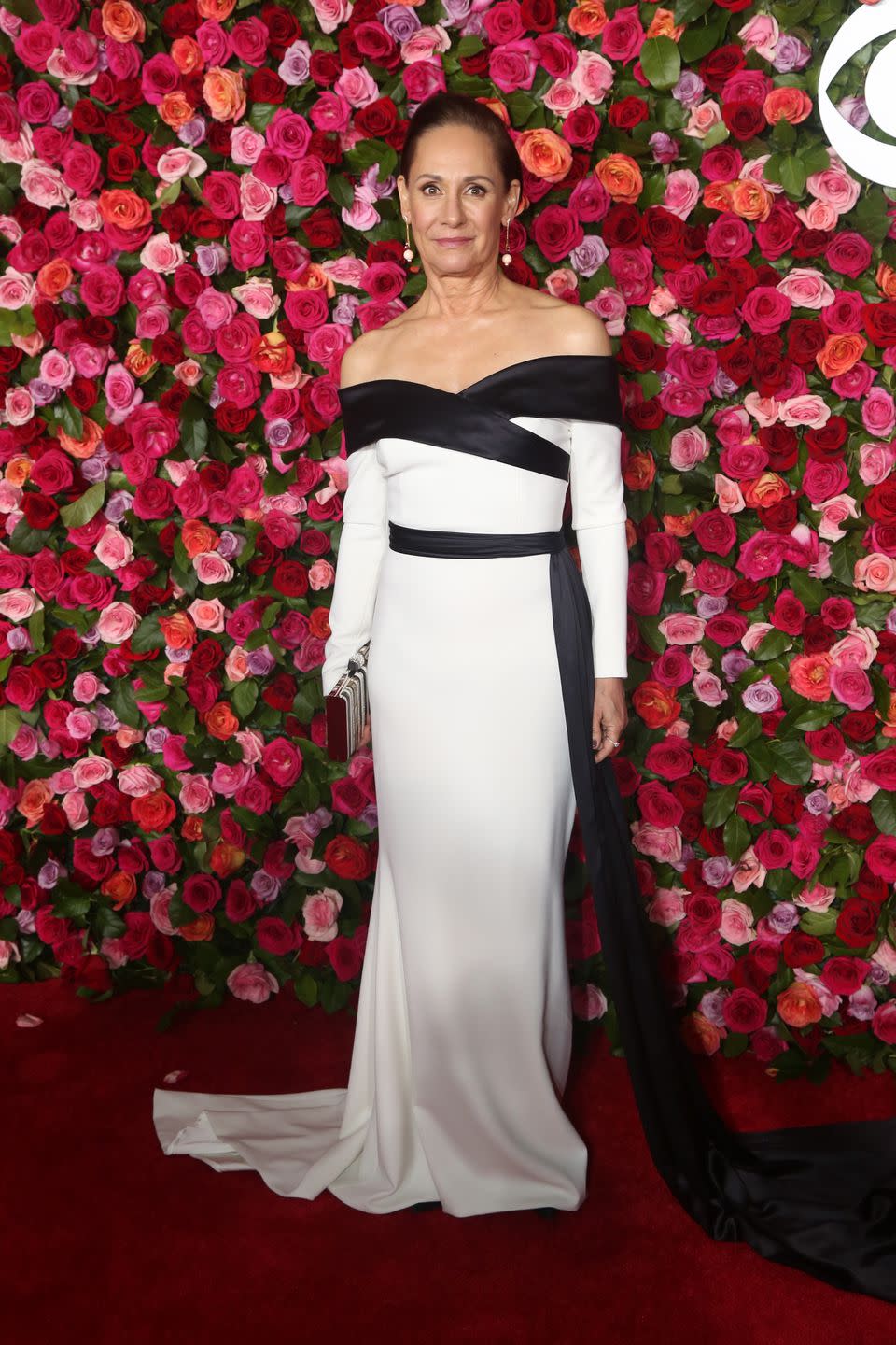 <p>In Christian Siriano, Pollice Lee heels, Leighton jewelry, and Judith Leiber clutch. </p>