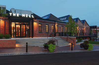 The Mill, a nonprofit center for entrepreneurship and coworking in Bloomington, Indiana, is housed in a century-old former furniture factory.  An award-winning renovation in 2018 preserved the iconic sawtooth roof and other historic features, while rebuilding the 19,000 square foot interior to support tech startups, remote workers and others in need. 21st century technological equipment.  The factory space includes coworking offices, private offices, conference rooms, an event hall, a cafe and much more.