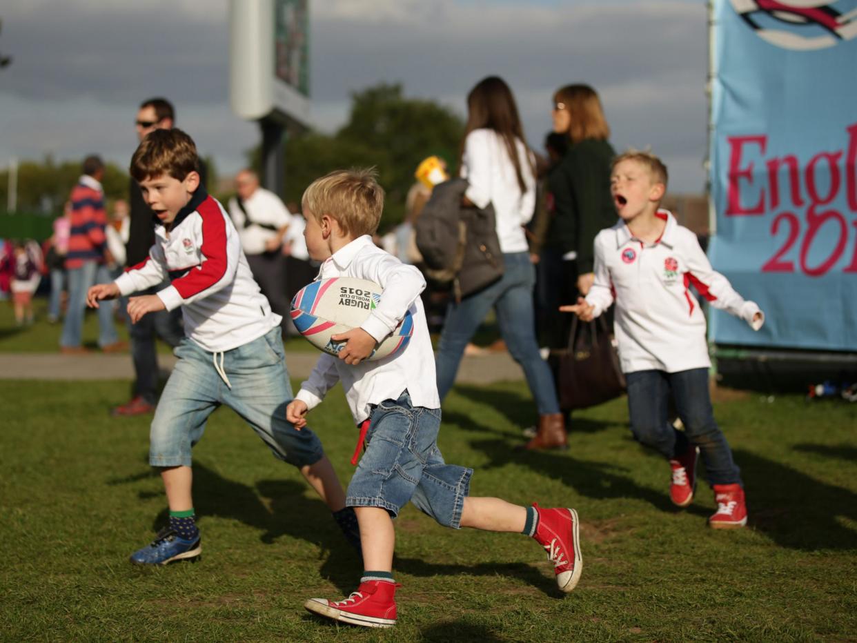 File photo: Children playing rugby at the Fanzone in Old Deer Park in Richmond, London: Yui Mok/PA Archive/PA Images