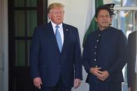 U.S. President Trump talks with Pakistan’s Prime Minister Khan as he arrives at the White House in Washington