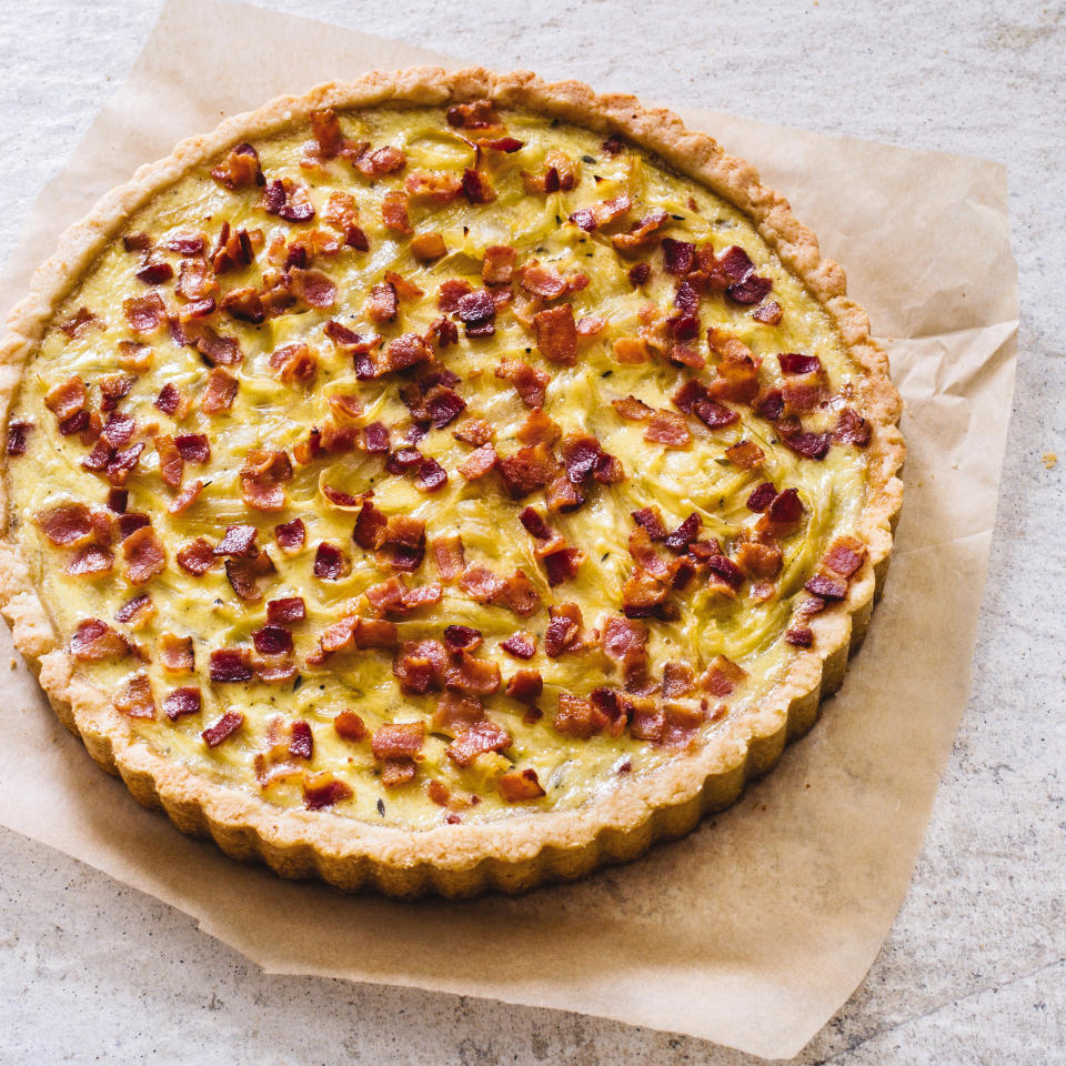 This undated photo provided by America's Test Kitchen in October 2018 shows a French onion and bacon tart in Brookline, Mass. This recipe appears in the cookbook “ATB Brunch.” (Carl Tremblay/America's Test Kitchen via AP)