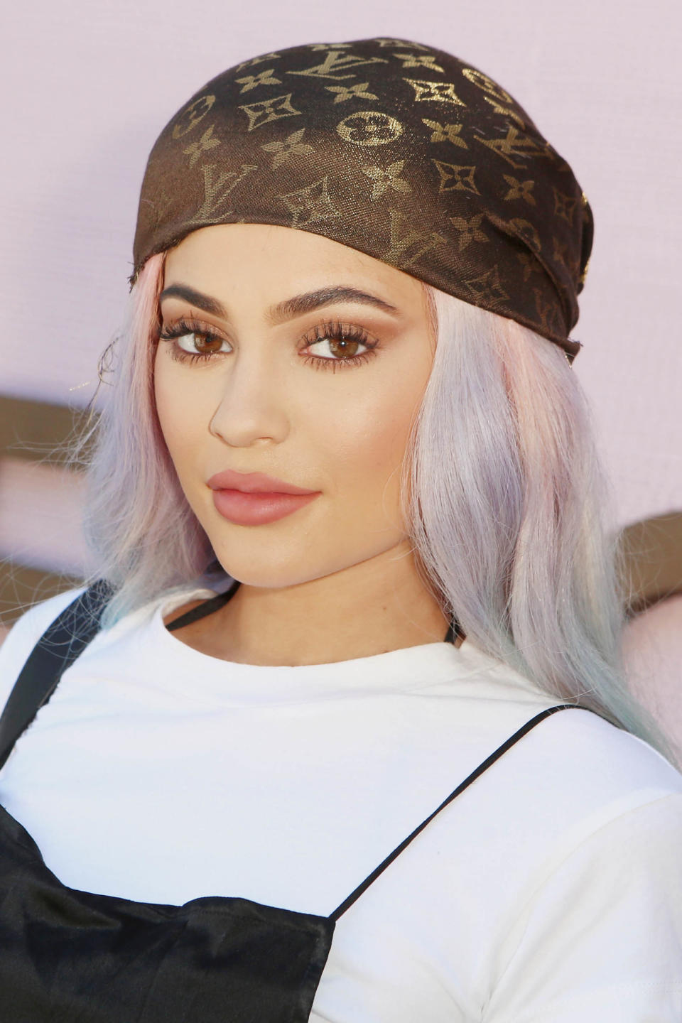 <p>Letting her hair down (with a Louis Vuitton headscarf, naturally) at Coachella 2016 with a pastel rainbow look. </p>