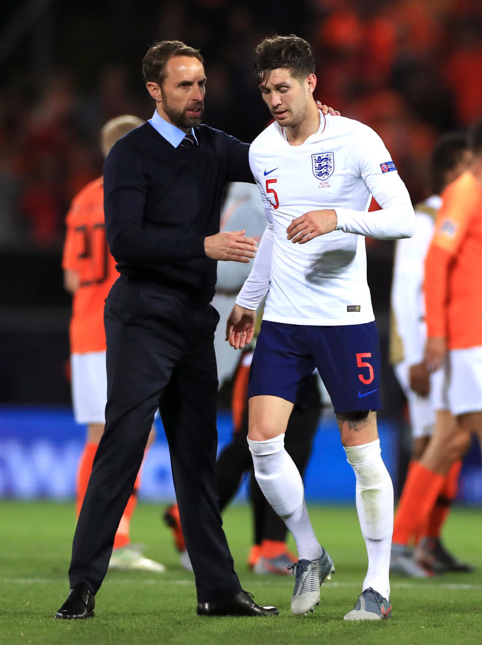 England head coach Gareth Southgate embraces John Stones after the Nations League Semi Final at Estadio D. Alfonso Henriques, Guimaraes.