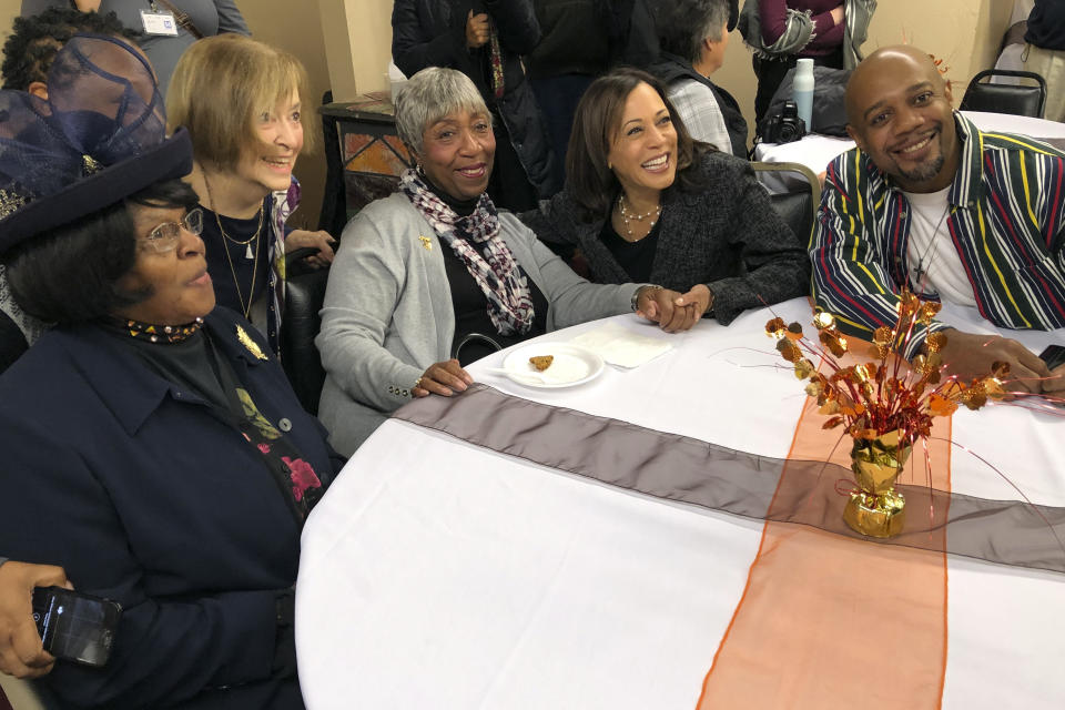 Democratic presidential candidate Sen. Kamala Harris, D-Calif., poses for a photo with Charlene Washington, left, Odell Woodley, third from left, and Nathaniel Naylor, right, at a church congregation breakfast in Fort Dodge, Iowa, on Nov. 10, 2019. Harris is campaigning regularly in Iowa as she seeks to boost her struggling campaign. (AP Photo/Kathleen Ronayne)