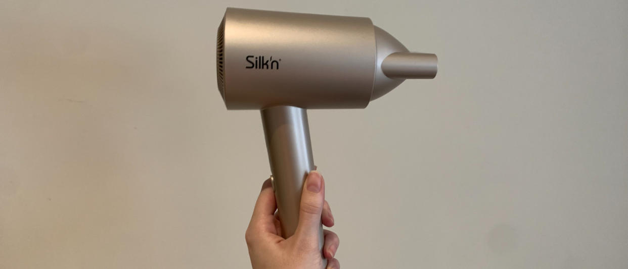  Silk'n silkyair pro being held against a white background 