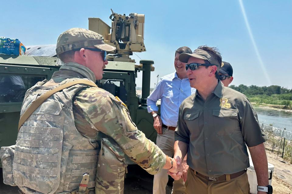 Louisiana Gov. Jeff Landry shakes hands with an unidentified Baton Rouge soldier Thursday, May 9, 2024 while visiting the Louisiana National Guard troops deployed to the U.S. southern border in Texas.