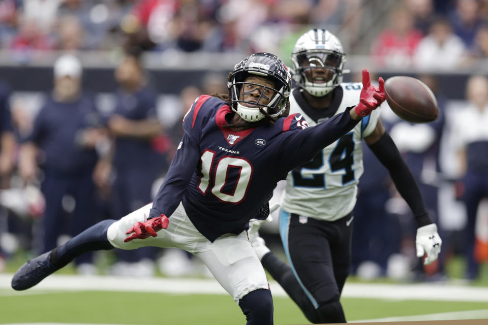 Houston Texans wide receiver DeAndre Hopkins (10) misses a pass as Carolina Panthers cornerback James Bradberry (24) defend the play during the second half of an NFL football game Sunday, Sept. 29, 2019, in Houston. (AP Photo/Michael Wyke)