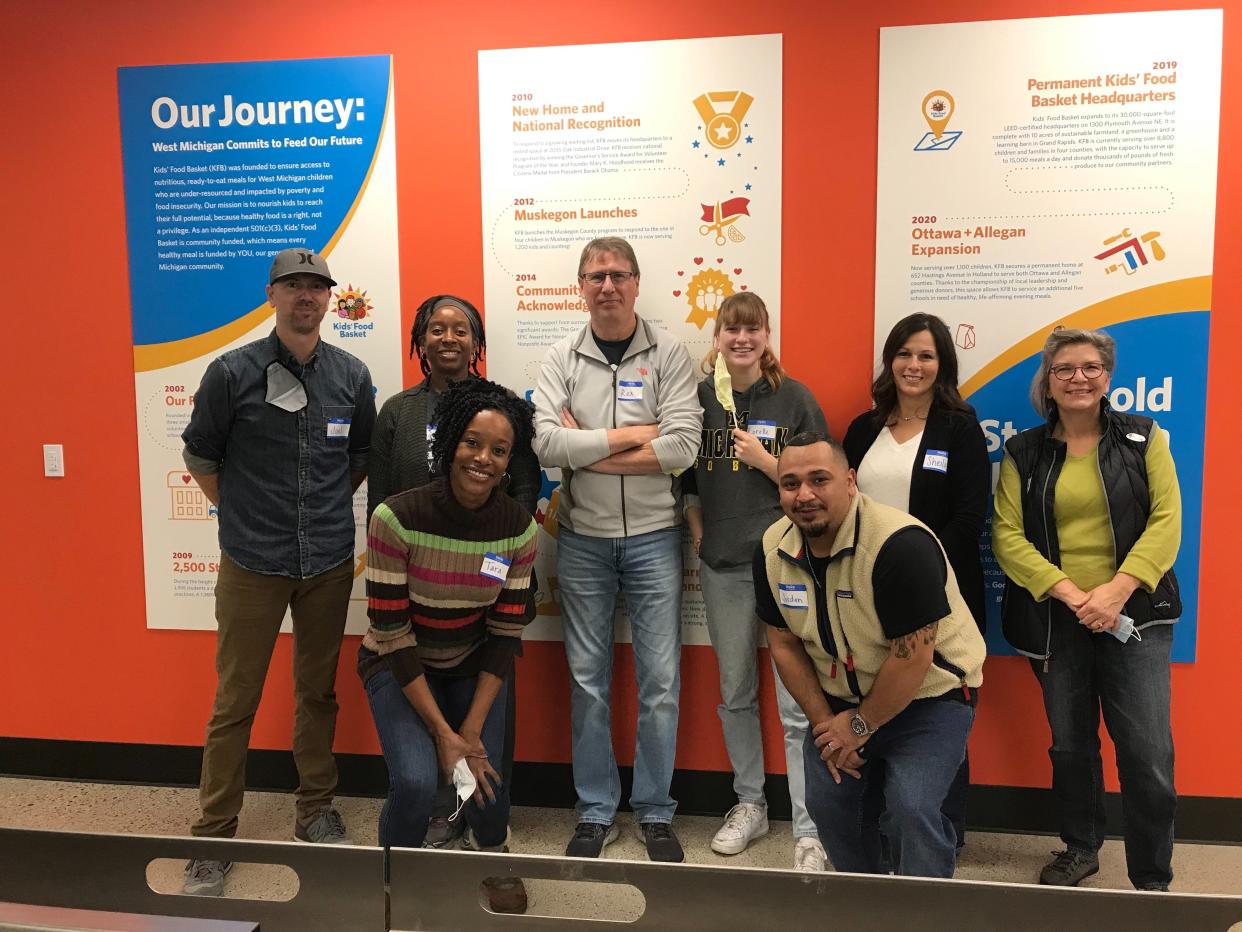 Volunteers from MillerKnoll offer their services at Kids' Food Basket in Holland as part of the company's Global Day of Purpose on Tuesday, Nov. 2.