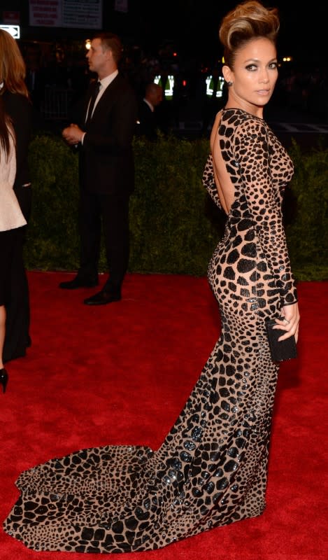 <p>Kevin Mazur/WireImage</p><p>Jennifer Lopez is one of the only stars who generally dresses on theme! Here, she rocked a backless, sequined, sheer Michael Kors gown and a pompadour at the 2013 Met Gala, "PUNK: Chaos to Couture." </p>