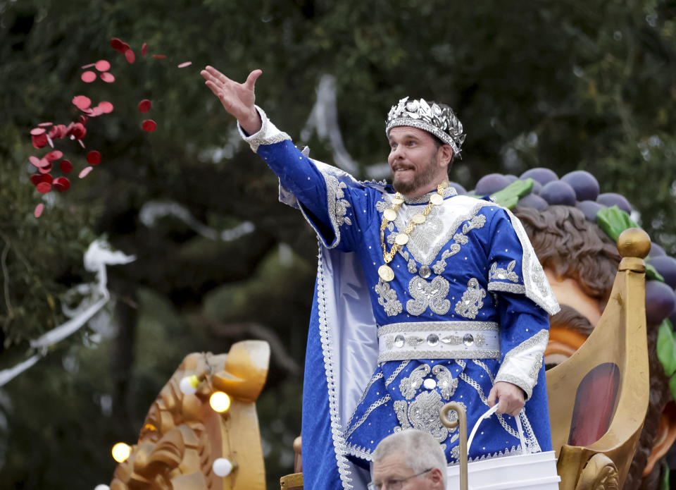 Actor Kevin Dillon reigns as Bacchus LV as the Krewe of Bacchus rolls in New Orleans, Sunday, Feb. 11, 2024, to the theme, 'Take a Number, Please.' The parade featured over 1,700 riders on 32 floats. (Scott Threlkeld/The Times-Picayune/The New Orleans Advocate via AP)