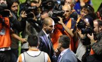 Barcelona's coach Josep Guardiola celebrates after the Spanish League football match against Levante at Ciutat de Valencia stadium in Valencia. Barcelona were crowned Spanish champions for the third successive season with a 1-1 draw at Levante clinching a 21st domestic title with two games to spare