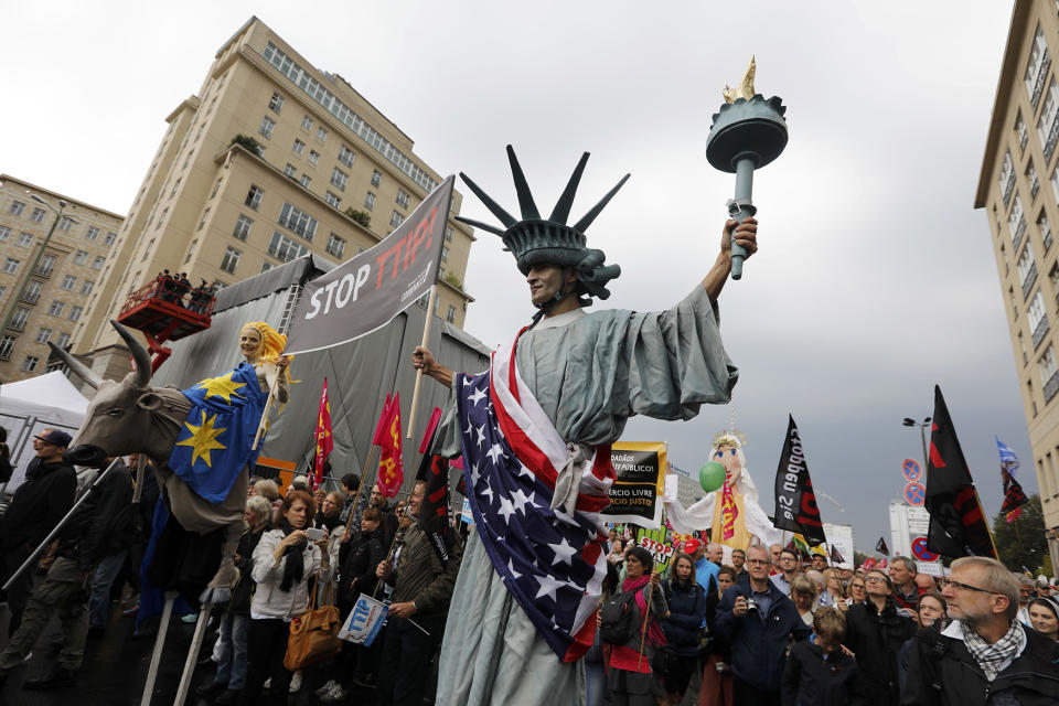 Consumer rights activists take part in a march to protest against TTIP and CETA in Berlin