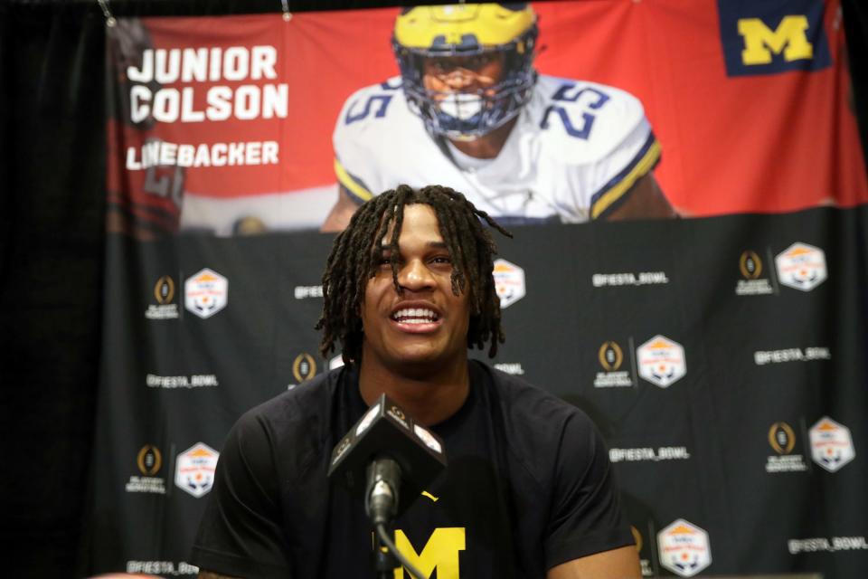 Michigan linebacker Junior Colson talks with reporters about the Fiesta Bowl against TCU on Wednesday, Dec. 28, 2022, in Scottsdale, Arizona.