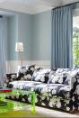 <p>Set against classic blue grasscloth wallpaper and white trim, the soft blue curtains in this room by designer <a href="https://www.housebeautiful.com/design-inspiration/house-tours/a26910606/colorful-california-home-neon-coffee-table/" rel="nofollow noopener" target="_blank" data-ylk="slk:Heather Hilliard" class="link ">Heather Hilliard</a> add elegance. The floral sofa and the green lucite coffee table are reminiscent of the California home's natural surroundings.</p>