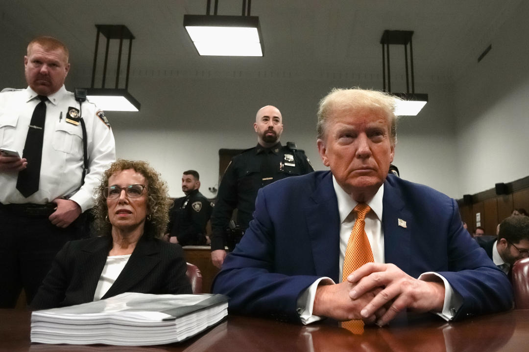 Donald Trump and attorney Susan Necheles sit in court.
