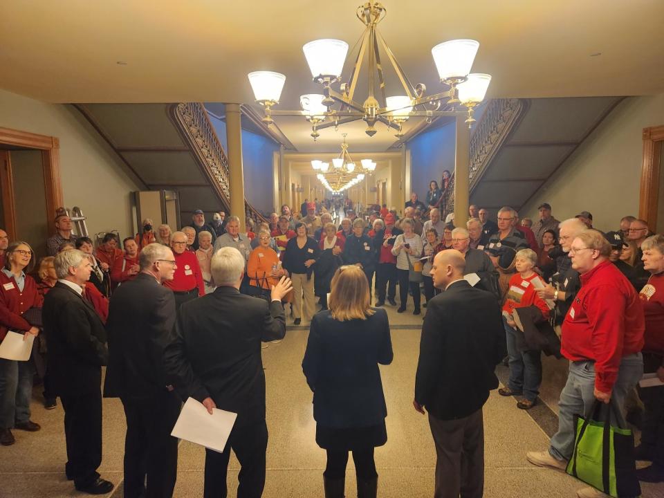 About 70 Iowa farmers and landowners converge at the Iowa Capitol to urge lawmakers to pass legislation that would restrict three companies' ability to use eminent domain to build carbon capture pipelines.