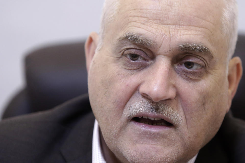 Lebanese Health Minister Jamil Jabak speaks during an interview at his private clinic in a southern suburb of Beirut, Lebanon, Saturday, May 18, 2019. Jabak says he has "overcome" U.S. concerns over the possibility of his ministry's finances going to the Hezbollah militant group, by gaining public trust and ensuring transparency. (AP Photo/Hassan Ammar)