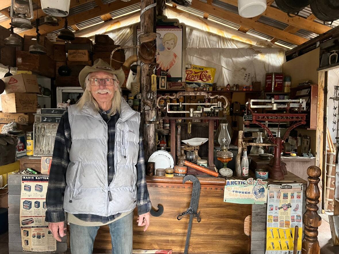 Sid van der Meer stands in his replica general store in Beaver Creek, Yukon. It's part of van der Meer's ramshackle museum of historic artifacts, collected over a lifetime in the territory.  (Paul Tukker/CBC - image credit)