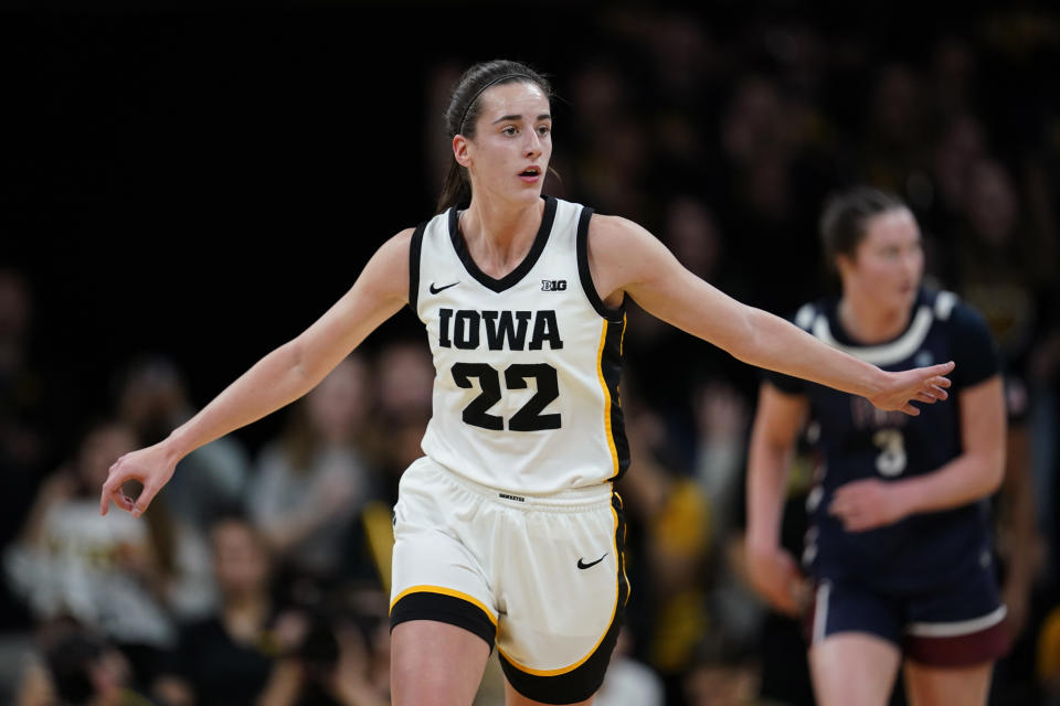 Iowa guard Caitlin Clark (22) reacts after making a 3-point basket during the first half of an NCAA college basketball game against Fairleigh Dickinson, Monday, Nov. 6, 2023, in Iowa City, Iowa. (AP Photo/Charlie Neibergall)